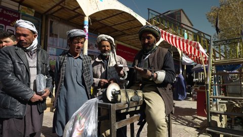 Bamyan , Afghanistan - 11 06 2020: Local Man Sharpening An Old Hacksaw Using Pedal Grinder