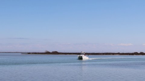 Coropus Christi , Texas , United States - 02 11 2021: Fishing boat motoring along the Intercoastal Waterway
