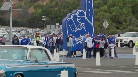 Los Angeles , CA , United States - 05 11 2021: Los Angeles Dodgers fans entering Dodger stadium to watch the Baseball game