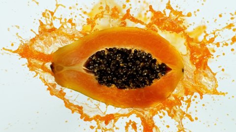 Super Slow Motion Shot of Fresh Papaya with Splashing Juice at 1000fps.