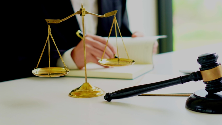 Hammers, judges and golden scales on lawyers are working in the room. Royalty-Free Stock Footage #1074477983