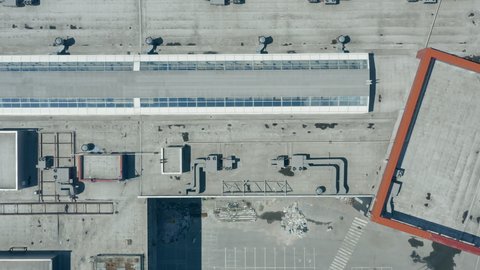 The air conditioning and ventilation system on the concrete roof of the shopping center is an overhead drone shot. The cooling, ventilation and air conditioning system installed on the roof.