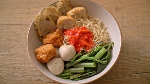 egg noodles with fish balls and shrimp balls in pink sauce, Yen Ta Four or Yen Ta Fo - Asian food style