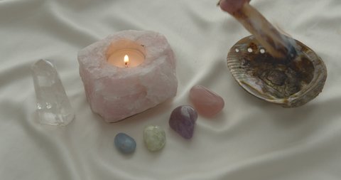 Rose Quartz Candle Magick Palo Santo smudge ritual with healing crystals