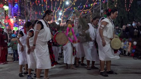 Sauraha, Nepal - February 14, 2021: A traditional Tharu cultural dance performed at night in the small town of Sauraha in the Chitwan region of Nepal.