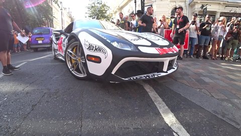 London , United Kingdom (UK) - 08 04 2018: Low angle close up shot of ferrari luxury racing car on london roads during Gumball 3000 event. 