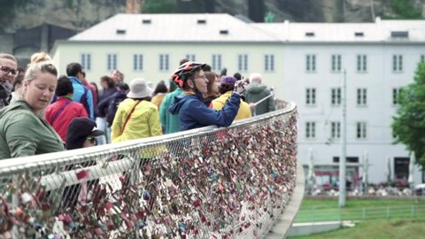 Salzburg , Austria - 05 30 2019: Tourists At The Famous Makartsteg Bridge