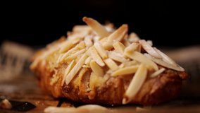 Almonds sliced falling into croissant in slow motion - Powered by Shutterstock - Get 15% off with code: PIKWIZARD15