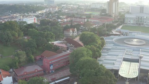 Malaka City, Malaysia - December 21, 2020: Aerial drone cinematic establishing shot of Melaka city center, famous tourist location at Malaysia. 