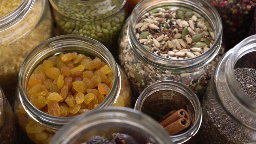 Grocery stock, food reserve. Glass Cereal Jars. Zero Waste Shopping. Seeds, nuts, cereals and dried fruits. Buying and Storage Food Package free. Reduce packaging waste. Healthy eating | Shutterstock HD Video #1074492839