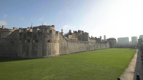 Revealing shot of the walls and tower of Tower of London, England