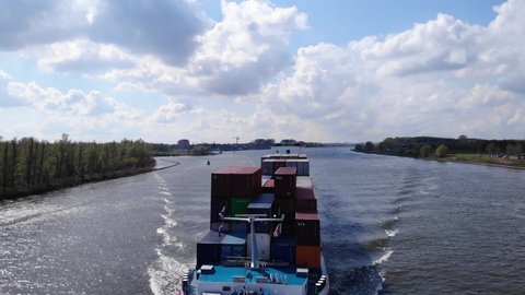 zwijndrecht , Zuid-Holland , Netherlands - 05 01 2021: Container Vessel Sails On The Oude Maas River Under Clear Sky In Netherlands. 