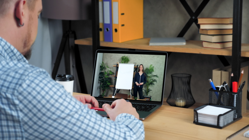 Businessman at home office study watch online business webinar course lesson, listen teacher. Woman coach near whiteboard in laptop computer screen tells teaches student remote video call webcam chat - Powered by Shutterstock - Get 15% off with code: PIKWIZARD15