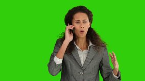 Chroma-key footage of a nervous african american lady making a phone call 