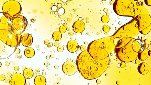 Super Slow Motion Shot of Pouring Oil Isolated on White Background at 1000fps.