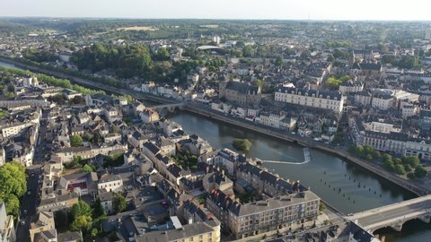 View from drone of houses and Mayenne river at Laval town at sunny summer day, France