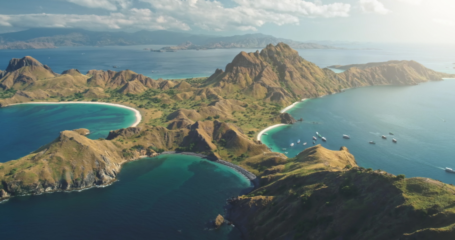 Padar Komodo Island Aerial Panorama. Travel destination. Nature background. Beautiful wild landscape. Exotic summer holiday. Travel, outdoor tourism, vacation. Cinematic drone flight Flores, Indonesia Royalty-Free Stock Footage #1074561869