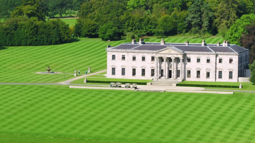 Aerial dolly shot moving in towards Ballyfin Demesne on beautiful day.