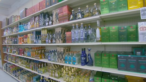 Nuevo Progreso , Tamaulipas , Mexico - 01 06 2021: panning shelves full of bottles of alchol
