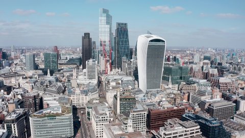 London , London , United Kingdom (UK) - 04 03 2021: London Aerial drone shot into skyscraper cluster to Gherkin building