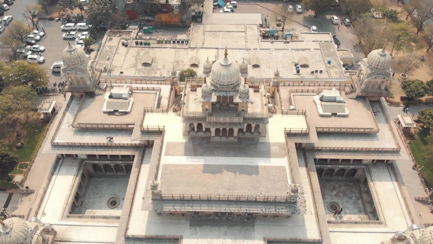Beautiful Albert Hall Museum in Ram Niwas garden in Jaipur, Rajasthan, India - Aerial Ascending tilt-up reveal