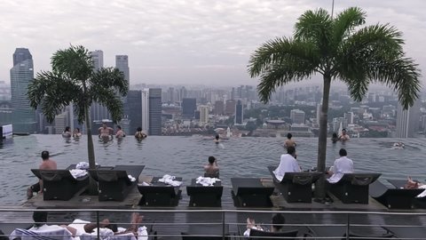 Singapore , Southeast Asia , Singapore - 02 28 2019: Marina Bay Sands Infinity Pool view over Urban Singapore Landscape