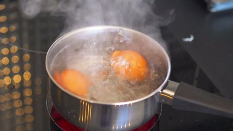 Eggs boiling in the pot in slow motion 180fps