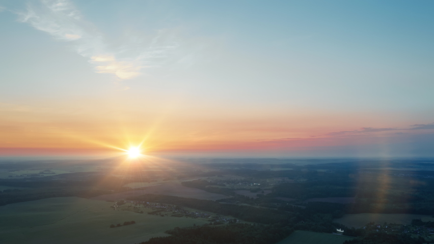 Aerial time-lapse hyperlapse summer morning in forest. Bright sun rises over wonderful woodland. Drone flight over trees. Beautiful dawn. Idyllic landscape sunrise. Sun beams in moving clouds Royalty-Free Stock Footage #1074588818