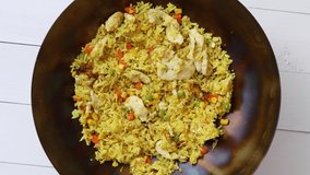 Delicious Thai dish in hot Wok. Fried chicken with rice and vegetables. Spin 360. Slow motion - Powered by Shutterstock - Get 15% off with code: PIKWIZARD15