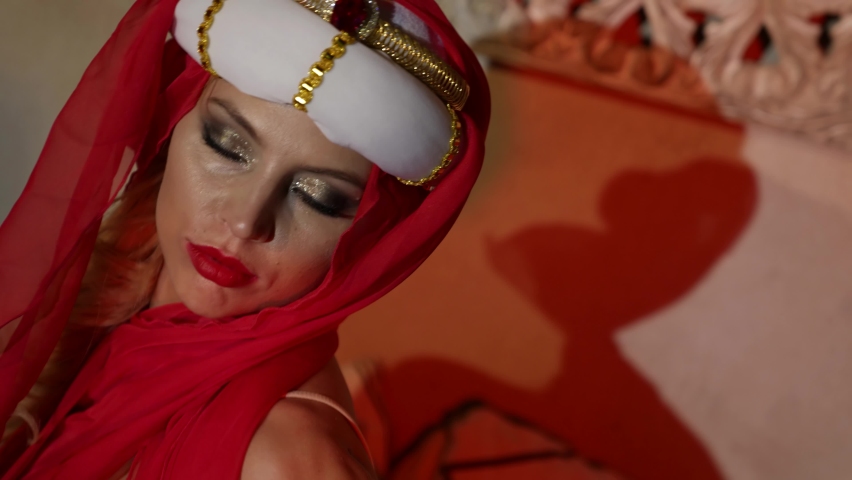 blonde woman is dressed in turkish traditional clothing, portrait of concubine in harem