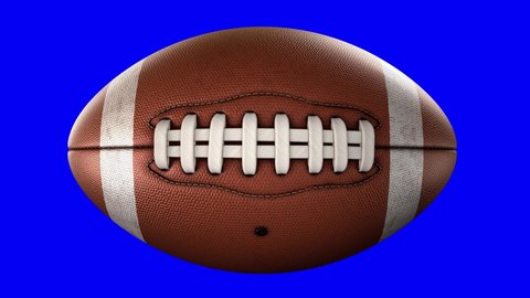 American football ball rotating in motion on blue screen with alpha-channel. Looped American football 3d Animation. 3d. 4K