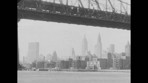 1950s:Manhattan from under the Queensboro Bridge. UN Building and Chrysler Building. Lower Manhattan skyline.