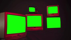 Five Old TV Sets Turning Off Green Screens and Retro TV Stack. Zoom in. Night Tone.