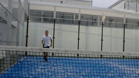 Paddle tennis player training in court - Powered by Shutterstock - Get 15% off with code: PIKWIZARD15
