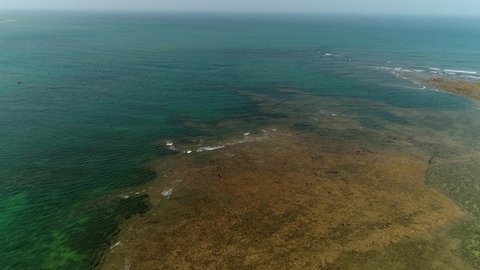 Okha , Gujarat , India - 03 31 2021: Sea Aerial view, Top view,amazing nature background.The color of the water and beautifully bright.Azure beach with rocky mountains Redaktionell stockvideo