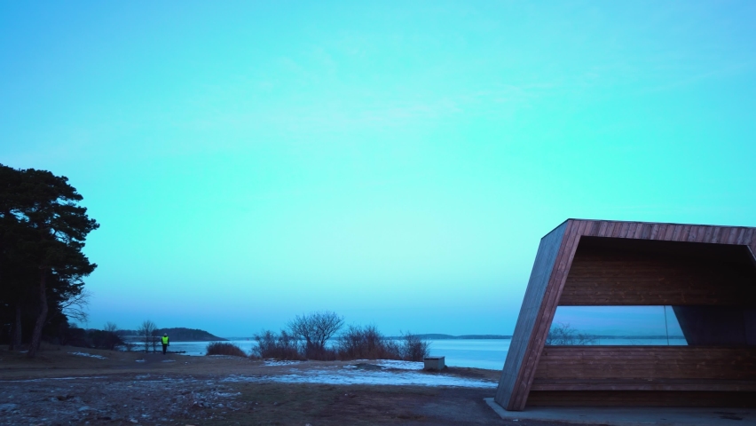 A modern shelter at a Norwegian beach during wintertime