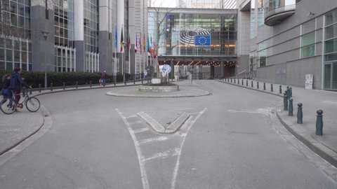 Brussels , Belgium - 03 08 2021: People Walk Near The Entrance Of European Parliament Building