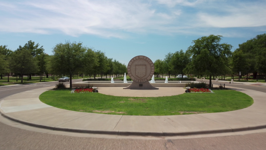 Lubbock, Texas - June 5, 2021: Texas Tech University Seal and Amon G. Carter Plaza lawn