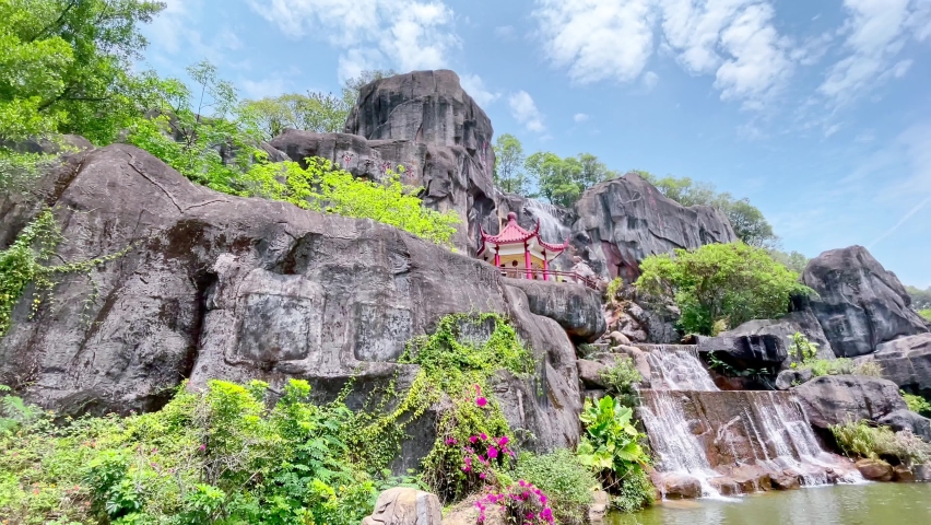 4KUHD - Landscape with pavilion and waterfall  in oriental nature garden in Fuzhou,Fujian,China. Pan shot and real time