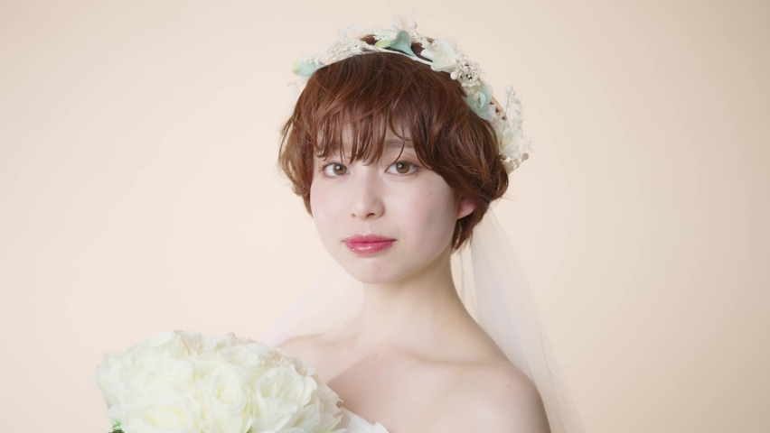 Young asian woman wearing wedding dress. Bridal concept.