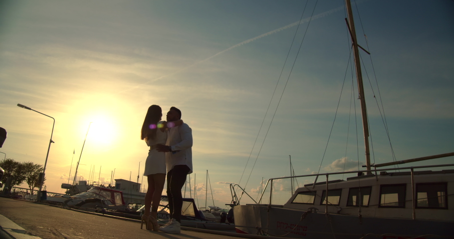 Couple standing in port in summer | Shutterstock HD Video #1074644420