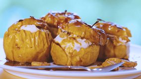FHD Video of a Tasty Baked Apples with Cheese Dressed with Honey and Sprinkle with Cinnamon and Nuts. Time Lapse. Accelerated Motion.