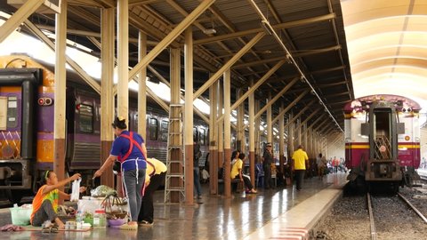 BANGKOK, THAILAND - 11 JULY, 2019: Hua Lamphong railroad station, state railway transport infrastructure SRT. Passengers on platform, people and commuters, trains on tracks. Rail road terminal hub