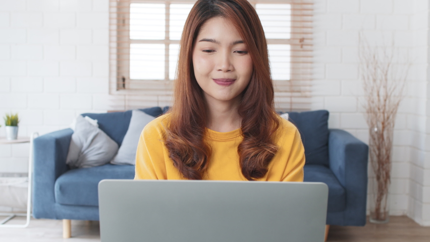 Group of young Asian business people, office coworker on video online conference call, remote team meeting. Work from home, internet communication technology, coronavirus social distancing lifestyle | Shutterstock HD Video #1074657437