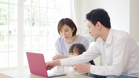 Asian girl and parents watching a laptop pc. Online education. e-learning.