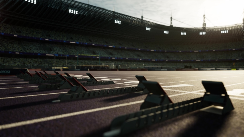 Sport outdoor athletics arena with start blocks on the runway. Stadium in the sunlight. High quality 4k footage