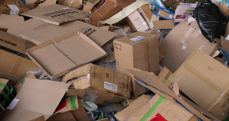 Garbage dump, cardboard boxes. Close-up. Waste recycling. Environmental protection concept. Royalty-Free Stock Footage #1074658838