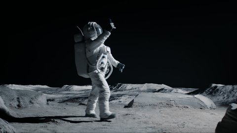 Astronaut searching for cellular or wi-fi signal while walking on Moon surface. Shot with 2x anamorphic lens