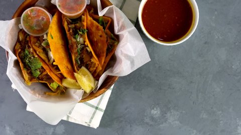 a bowl of delicious birria tacos; It's a dish that is very popular in Mexico that consist of goat meat or beef, stewed in perfection
