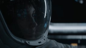 Portrait of Caucasian female astronaut inside spaceship cockpit. Sci-fi space exploration concept. Moon mission. Shot with 2x Anamorphic lens - Powered by Shutterstock - Get 15% off with code: PIKWIZARD15